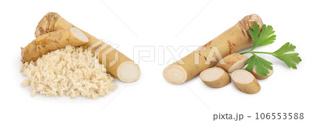 Horseradish root with slices grated pile isolated on white background Horseradish root with slices grated pile isolated on white background 106553588