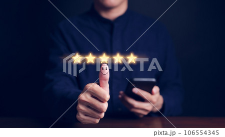 Man hand with thumb up positive emotion smile face icon and five star. Customer review satisfaction feedback survey concept. User give rating to service excellent experience on smartphone application, Man hand with thumb up positive emotion smile face icon and five star. Customer review satisfaction feedback survey concept. User give rating to service excellent experience on smartphone application, 106554345