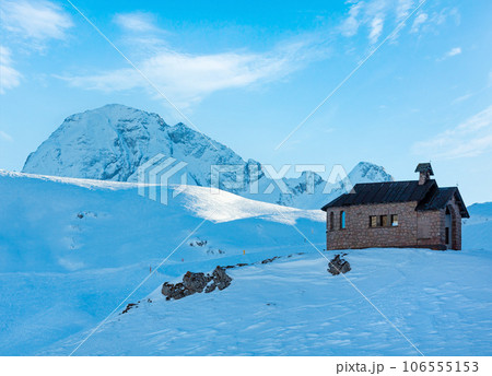 Beautiful winter mountain landscape with chapel on hill top. 106555153