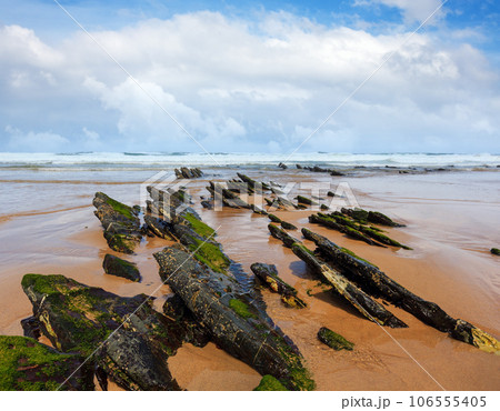 Rock formations on sandy beach (Portugal). 106555405
