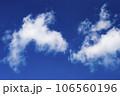 White cumulus clouds against the blue sky. 106560196