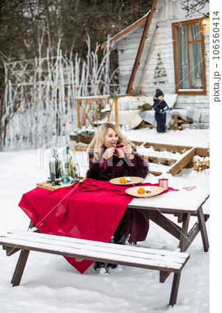 portrait of a young girl in the winter drink 106560414