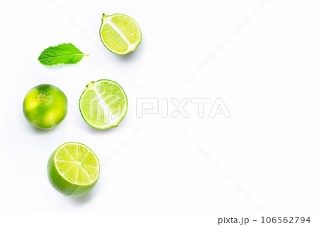 Limes with mint leaves isolated on white background. Limes with mint leaves isolated on white background. 106562794