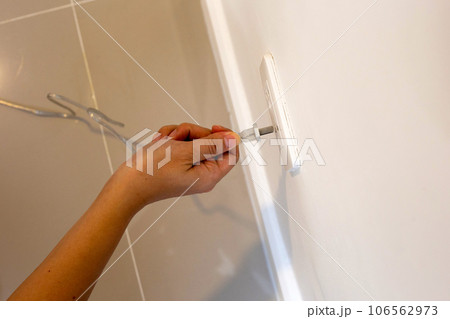 Hand insert a plug into socket. Hand insert a plug into socket. 106562973
