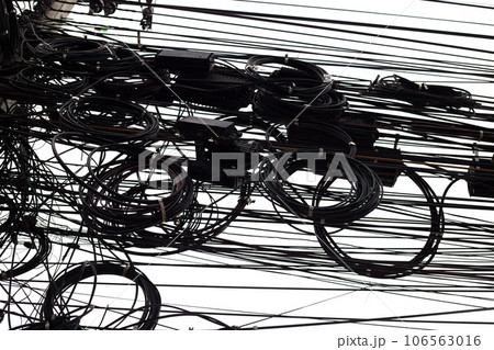 Many electrical cable are tangled on an electric pole. Many electrical cable are tangled on an electric pole. 106563016