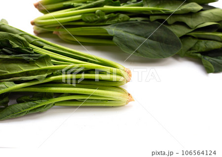 Fresh spinach on white background Fresh spinach on white background 106564124