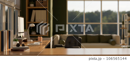 Copy space on a wooden desk in a modern cozy home working room or office. Copy space on a wooden desk in a modern cozy home working room or office. 106565144