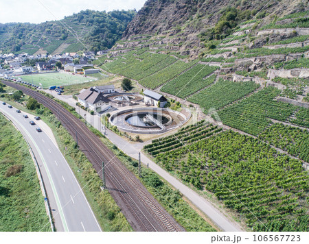 Aerial view of modern industrial sewage treatment plant beside the moselle river in germany Aerial view of modern industrial sewage treatment plant beside the moselle river in germany 106567723
