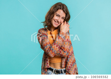 Young woman spread hands and give hug to you, pleasant expression, love feelings, proud, satisfied 106569382