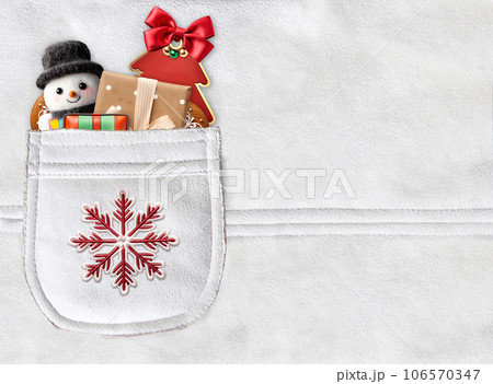 Horizontal Christmas backdrop with gifts in pocket on suede texture of ivory color. Xmas background with toys and gift box in suede pocket of light beige color 106570347