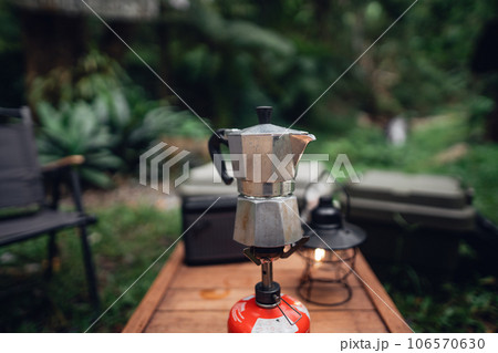 Moka pot coffee on outdoor camping table 106570630