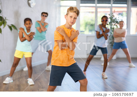 Dance studio - smiling girls and boys in dance lesson Dance studio - smiling girls and boys in dance lesson 106570697