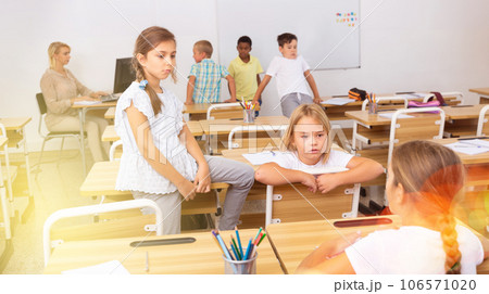 Kids pupils talking during recess between lessons Kids pupils talking during recess between lessons 106571020