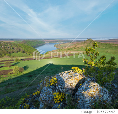 Amazing spring view on the Dnister River Canyon with picturesque rocks, fields, flowers. This place named Shyshkovi Gorby,  Nahoriany, Chernivtsi region, Ukraine. 106572447