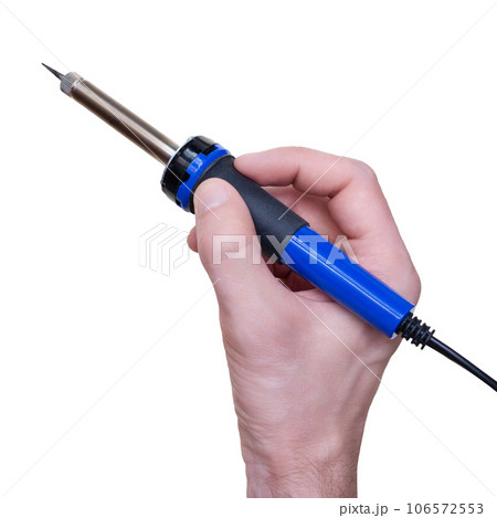 A man is holding a soldering iron in his hand. Isolated on a white background. 106572553