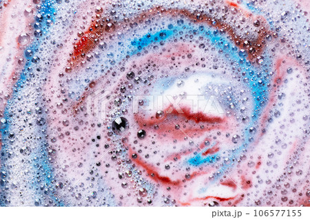 Foam of bath bomb dissolved in water. Soap sud background. Abstract soap foam texture. 106577155