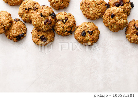 Oatmeal cranberry healthy homemade cookies with cinnamon and pecan nuts for breakfast Oatmeal cranberry healthy homemade cookies with cinnamon and pecan nuts for breakfast 106581281