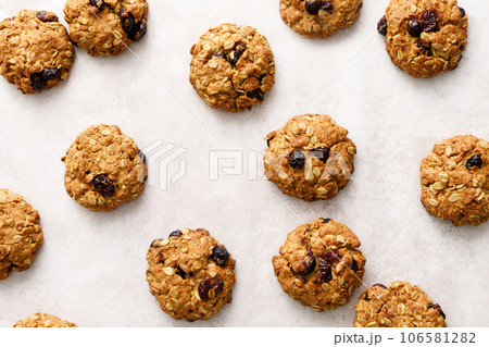 Oatmeal cranberry healthy homemade cookies with cinnamon and pecan nuts for breakfast Oatmeal cranberry healthy homemade cookies with cinnamon and pecan nuts for breakfast 106581282
