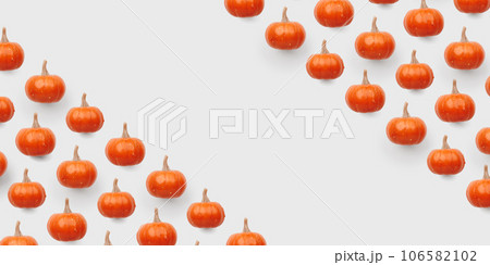 Orange pumpkin pattern on pastel color background 106582102