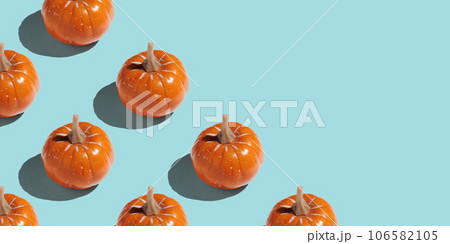 Orange pumpkin pattern on pastel color background 106582105