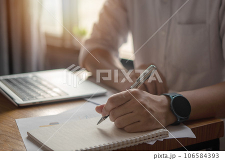 Hands Writing with Pen on Notebook. concept of work, study, and education. 106584393