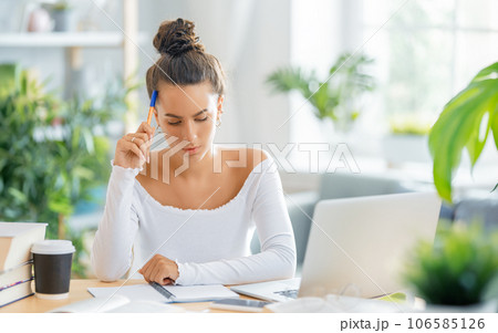 woman working on laptop at home 106585126