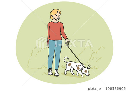 Girl walking dog on leash 106586906