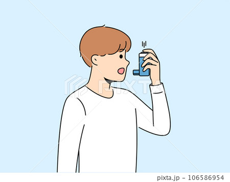 Boy uses inhaler to treat asthma attack due to difficulty breathing and lung disease 106586954