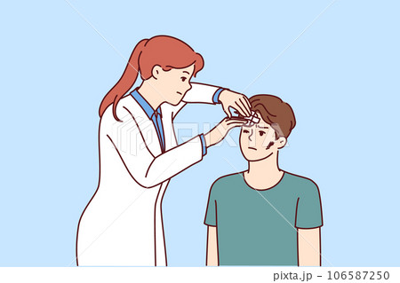 Doctor assists injured patient with head abrasions after accident or fight with criminal 106587250