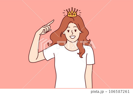 Woman with golden crown on head, smiling and looking at screen, showing confidence and narcissism 106587261