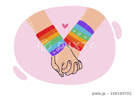 Hands of LGBT lovers in rainbow bracelets, for concept problems tolerance towards gays and lesbians 106589702
