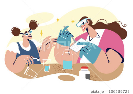 Little girl in chemistry lesson with school teacher standing near table with test tubes and reagents Little girl in chemistry lesson with school teacher standing near table with test tubes and reagents 106589725
