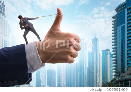 Businessman pulling rope in approve concept 106591400