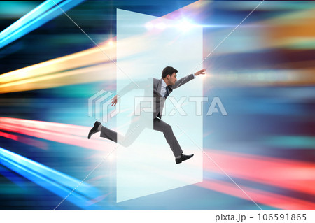 Businessman entering virtual world in business concept Businessman entering virtual world in business concept 106591865
