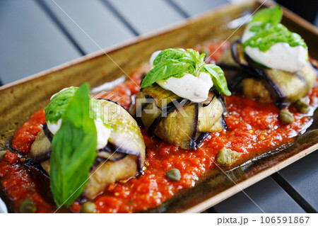 eggplant rolls in tomato sauce. Delicious recipes for vegetable dishes.  106591867