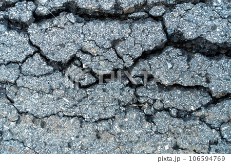 old broken road with cracked asphalt 106594769