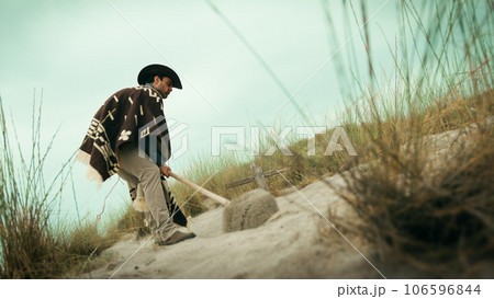 Man digs a grave in the desert Man digs a grave in the desert 106596844