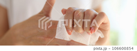 Female cleaning hands using antiseptic wet wipe, personal hygiene Female cleaning hands using antiseptic wet wipe, personal hygiene 106600854