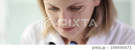 Woman scientist is working in laboratory with microscope. Woman scientist is working in laboratory with microscope. 106600871