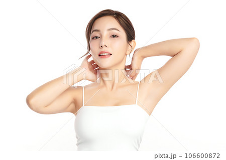 Beautiful Young Asian woman lifting hands up to show off clean and hygienic armpits or underarms on white background, Smooth armpit cleanliness and protection concept 106600872