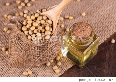 Soybean oil on a wooden background. rustic style Soybean oil on a wooden background. rustic style 106601107