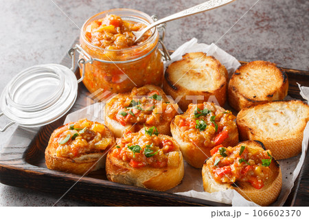 Spicy appetizer dip of eggplant, tomatoes, onions, bell peppers and garlic closeup. Horizontal Spicy appetizer dip of eggplant, tomatoes, onions, bell peppers and garlic closeup. Horizontal 106602370