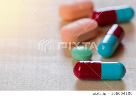 close up pills on wooden 106604100