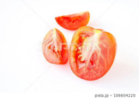 Red tomatos on a white background Red tomatos on a white background 106604220