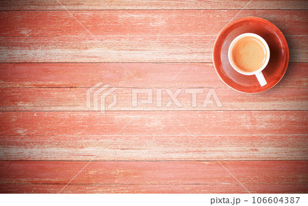 Red coffee cup on old wood background 106604387