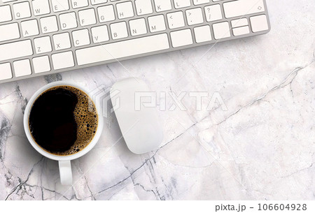 Morning black coffee and mini mouse and keyboard wireless on white marble background. Morning black coffee and mini mouse and keyboard wireless on white marble background. 106604928