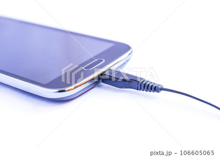 Close up black smartphone and USB cable on white background Close up black smartphone and USB cable on white background 106605065