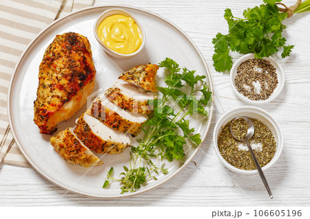 Baked Split Chicken Breasts on plate, top view 106605196