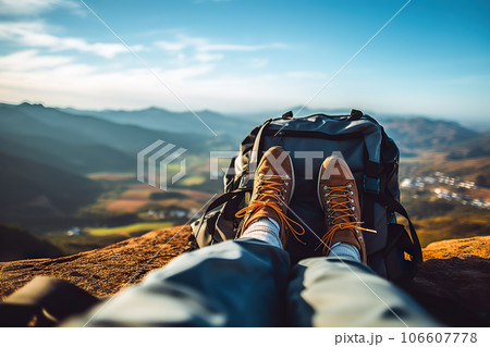 Adventurous Trekking Journey Tourist's Feet, Backpack, and Camera Capturing Stunning Panoramic Mountain Landscape. created with Generative AI 106607778