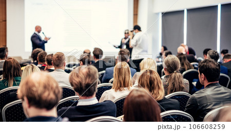 I have a question. Group of business people sitting at the chairs in conference hall. Businessman standing up asking a question. Conference and Presentation. Business and Entrepreneurship. I have a question. Group of business people sitting at the chairs in conference hall. Businessman standing up asking a question. Conference and Presentation. Business and Entrepreneurship. 106608259